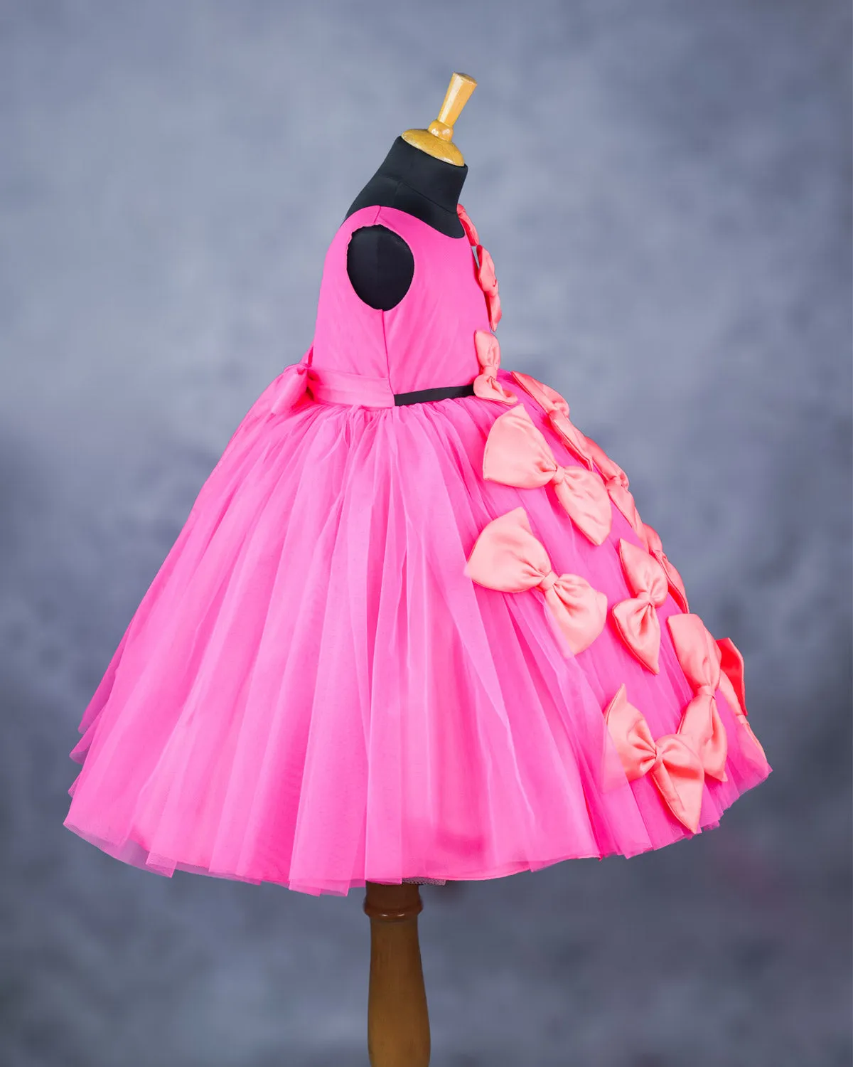 Pink and coral bow design gown