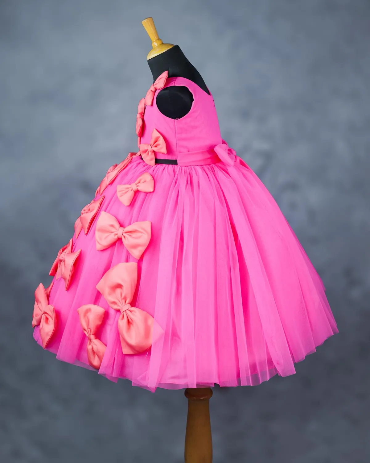 Pink and coral bow design gown