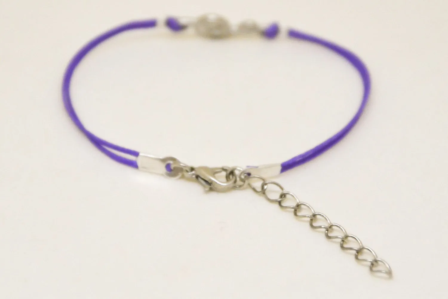 Purple cord bracelet with a silver Treble clef charm, music note jewelry