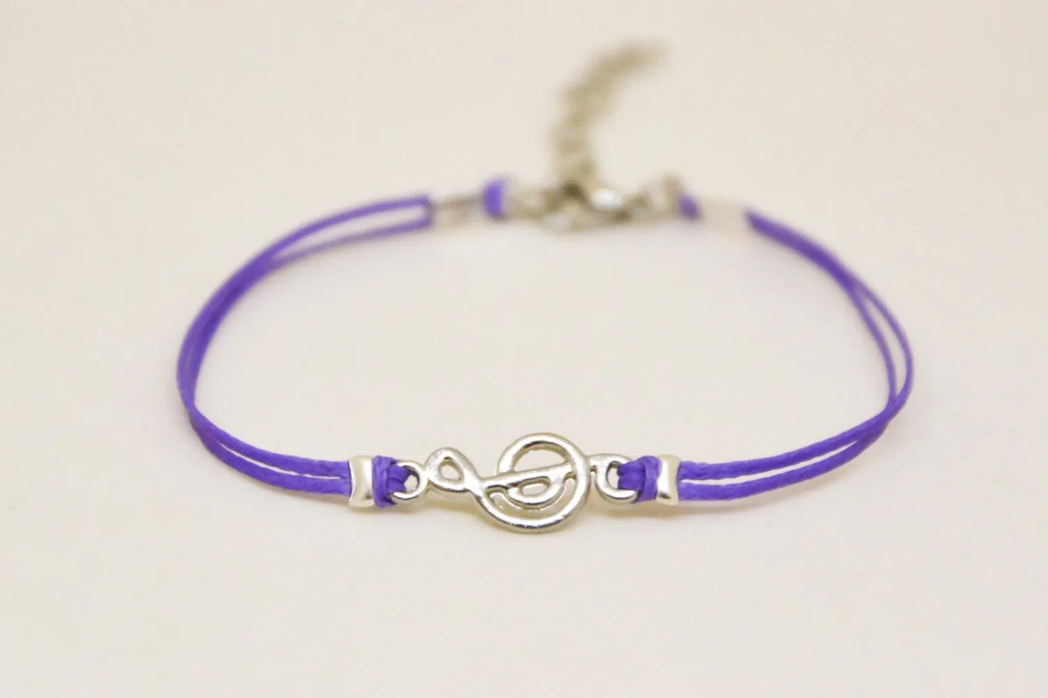 Purple cord bracelet with a silver Treble clef charm, music note jewelry
