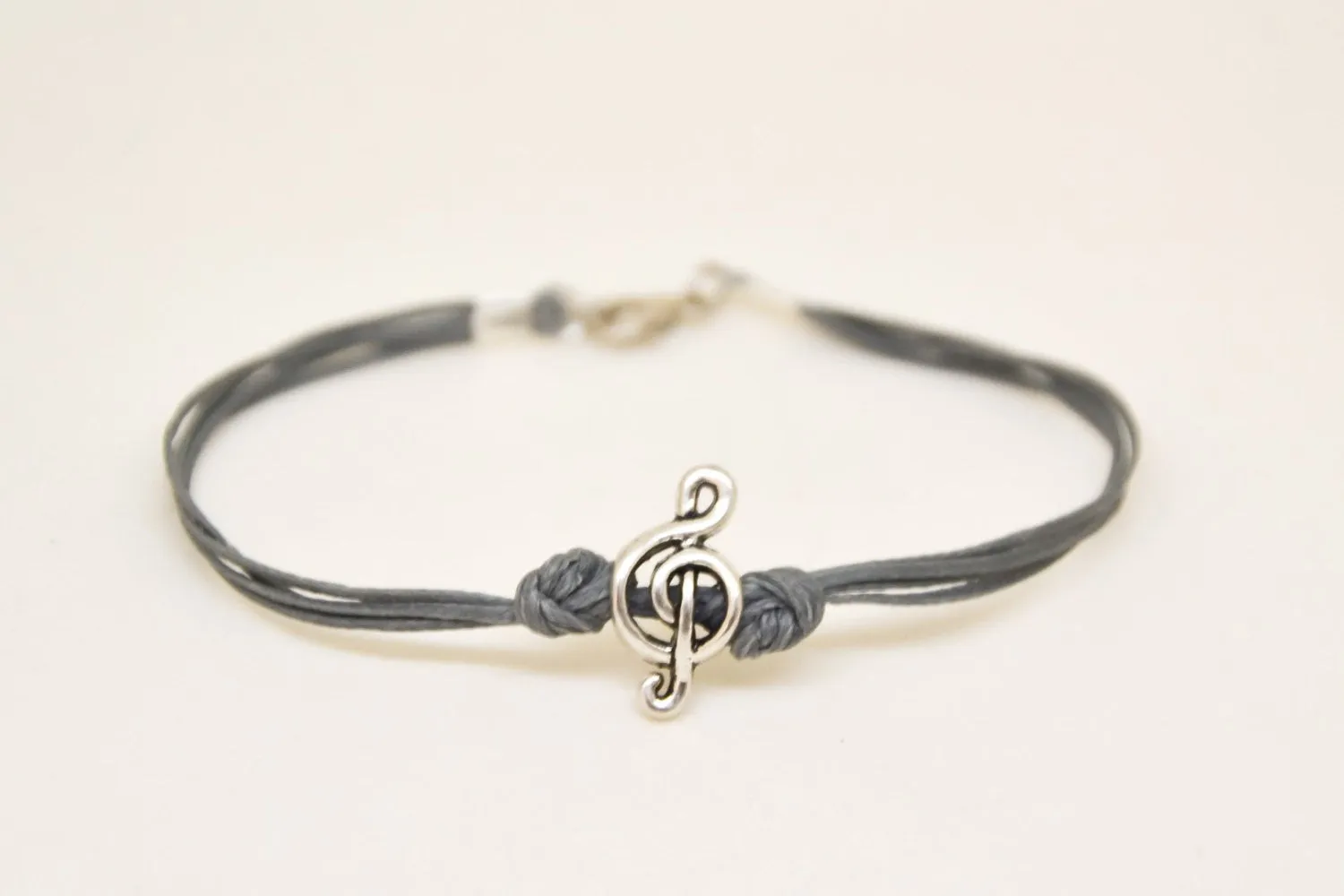 Silver Treble clef bracelet for men, gray cords, music note bead