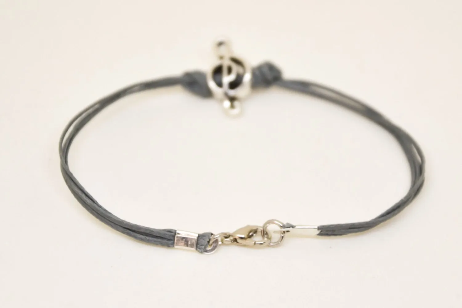 Silver Treble clef bracelet for men, gray cords, music note bead